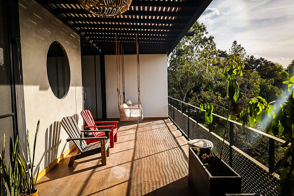 Expansive balcony with hanging swing and mountain views