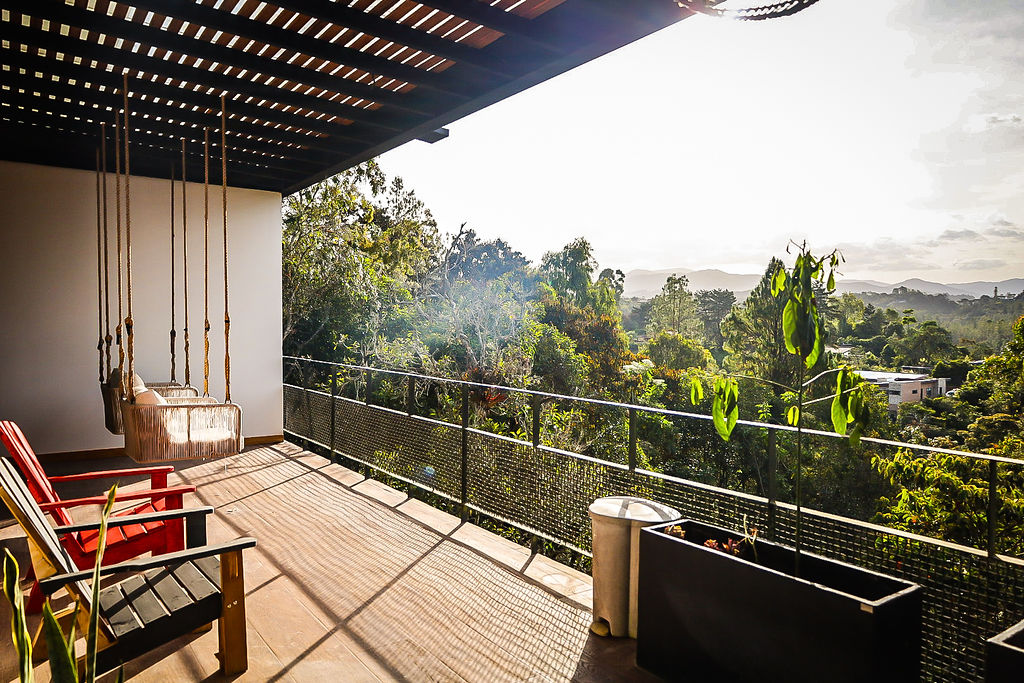 Balcony framed by mountain treetops
